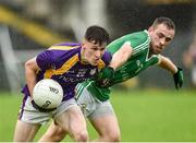 22 September 2019; Gavin McGovern of Derrygonnelly Harps in action against Brendan Sherlock of Roslea Shamrocks during the Fermanagh County Senior Club Football Championship Final match between Derrygonnelly Harps and Roslea Shamrocks at Brewster Park in Enniskillen, Fermanagh. Photo by Oliver McVeigh/Sportsfile