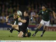 8 November 2003; Leon MacDonald, New Zealand, in action against Jorrie Muller, South Africa. 2003 Rugby World Cup, Quarter Final, New Zealand v South Africa, Telstra Dome, Melbourne, Victoria, Australia. Picture credit; Brendan Moran / SPORTSFILE *EDI*