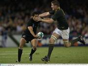 8 November 2003; Mils Muliaina, New Zealand, in action against Jorrie Muller, South Africa. 2003 Rugby World Cup, Quarter Final, New Zealand v South Africa, Telstra Dome, Melbourne, Victoria, Australia. Picture credit; Brendan Moran / SPORTSFILE *EDI*