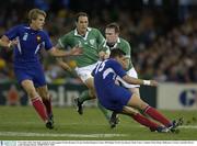 9 November 2003; John Kelly, Ireland, in action against Nicolas Brusque (15) and Aurelien Rougerie, France. 2003 Rugby World Cup, Quarter Final, France v Ireland, Telstra Dome, Melbourne, Victoria, Australia. Picture credit; Brendan Moran / SPORTSFILE *EDI*
