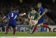 9 November 2003; Kevin Maggs, Ireland, in action against Sylvain Marconnet (3) and Imanol Harinordoquy, France. 2003 Rugby World Cup, Quarter Final, France v Ireland, Telstra Dome, Melbourne, Victoria, Australia. Picture credit; Brendan Moran / SPORTSFILE *EDI*