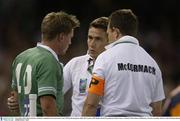 9 November 2003; Ronan O'Gara, Ireland, is attended to by team doctor Gary O'Driscoll and physio Ailbe McCormack. 2003 Rugby World Cup, Quarter Final, France v Ireland, Telstra Dome, Melbourne, Victoria, Australia. Picture credit; Brendan Moran / SPORTSFILE *EDI*