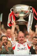28 September 2003; Tyrone captain Peter Canavan lifts the Sam Maguire cup. Bank of Ireland All-Ireland Senior Football Championship Final, Armagh v Tyrone, Croke Park, Dublin. Picture credit; Brendan Moran / SPORTSFILE