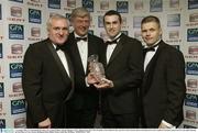 7 November 2003; An Taoiseach Bertie Ahern T.D. George Wallace, General Manager, SEAT, Muiris Gavin, SEAT GPA Fooballer of the Month for May and GPA Chief Executive Dessie Farrell pictured at the Carphone Warehouse sponsored GPA Gala night featuring the Seat Player of Year Awards, Burlington Hotel, Dublin. Picture credit; Ray McManus / SPORTSFILE *EDI*