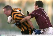 23 November 2003; Padraig Mullarkey, Round Towers, is tackled by Arles-Kilcruise's Chris Conway. AIB Leinster Club Football Championship Semi-Final, Arles-Kilcruise v Round Towers, Dr. Cullen Park, Carlow. Picture credit; Matt Browne / SPORTSFILE *EDI*