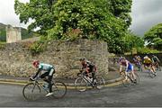 22 June 2013; David Peelo, Murphy's Surveyors, leads the peloton through Carlingford village during the 2013 National Elite Women's & Men's Veterans Road Race Championships. Carlingford, Co. Louth. Picture credit: Stephen McMahon / SPORTSFILE