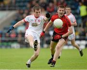 23 June 2013; Shea Hamill, Tyrone, in action against Daniel McCarthy, Down. Electric Ireland Ulster GAA Football Minor Championship Semi-Final, Down v Tyrone, Kingspan Breffni Park, Cavan. Picture credit: Oliver McVeigh / SPORTSFILE