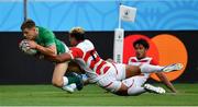 28 September 2019; Garry Ringrose of Ireland scores his side's first try despite the tackle of Lomano Lemeki of Japan during the 2019 Rugby World Cup Pool A match between Japan and Ireland at the Shizuoka Stadium Ecopa in Fukuroi, Shizuoka Prefecture, Japan. Photo by Brendan Moran/Sportsfile