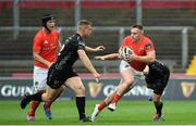 28 September 2019; Rory Scanell of Munster is tackled by Jack Dixon, left, and Adam Warren of Dragons during the Guinness PRO14 Round 1 match between Munster and Dragons at Thomond Park in Limerick. Photo by Matt Browne/Sportsfile