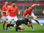 28 September 2019; Rory Scannell of Munster is tackled by Jack Dixon of Dragons during the Guinness PRO14 Round 1 match between Munster and Dragons at Thomond Park in Limerick. Photo by Matt Browne/Sportsfile