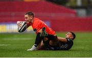 28 September 2019; Nick McCarthy of Munster is tackled by Ashton Hewitt of Dragons during the Guinness PRO14 Round 1 match between Munster and Dragons at Thomond Park in Limerick. Photo by Harry Murphy/Sportsfile