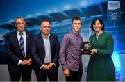 28 September 2019; Pictured is the Electric Ireland Minor Hurling All Star winner Patrick Kirby of Limerick at the 2019 Electric Ireland Minor Star Awards alongside, from left, Munster Council chairman Liam Lenihan, Derek McGrath and Executive Director of ESB Marguerite Sayers. The Hurling Team of the Year was selected by an expert panel of GAA legends including Alan Kerins, Derek McGrath, Karl Lacey and Tomás Quinn. The Electric Ireland GAA Minor Star Awards create a major moment for Minor players, showcasing the outstanding achievements of individual performers throughout the Championship season. The awards also recognise the effort of those who support them day in and day out, from their coaches to parents, clubs and communities. #GAAThisIsMajor Photo by David Fitzgerald/Sportsfile