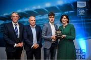 28 September 2019; Pictured is the Electric Ireland Minor Hurling All Star winner Alex Connaire of Galway at the 2019 Electric Ireland Minor Star Awards alongside, from left, Munster Council chairman Liam Lenihan, Derek McGrath and Executive Director of ESB Marguerite Sayers. The Hurling Team of the Year was selected by an expert panel of GAA legends including Alan Kerins, Derek McGrath, Karl Lacey and Tomás Quinn. The Electric Ireland GAA Minor Star Awards create a major moment for Minor players, showcasing the outstanding achievements of individual performers throughout the Championship season. The awards also recognise the effort of those who support them day in and day out, from their coaches to parents, clubs and communities. #GAAThisIsMajor Photo by David Fitzgerald/Sportsfile