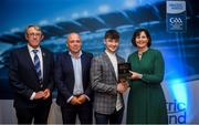 28 September 2019; Pictured is the Electric Ireland Minor Hurling All Star winner Seán McDonagh of Galway at the 2019 Electric Ireland Minor Star Awards alongside, from left, Munster Council chairman Liam Lenihan, Derek McGrath and Executive Director of ESB Marguerite Sayers. The Hurling Team of the Year was selected by an expert panel of GAA legends including Alan Kerins, Derek McGrath, Karl Lacey and Tomás Quinn. The Electric Ireland GAA Minor Star Awards create a major moment for Minor players, showcasing the outstanding achievements of individual performers throughout the Championship season. The awards also recognise the effort of those who support them day in and day out, from their coaches to parents, clubs and communities. #GAAThisIsMajor Photo by David Fitzgerald/Sportsfile