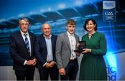 28 September 2019; Pictured is the Electric Ireland Minor Hurling All Star winner Ian McGlynn of Galway at the 2019 Electric Ireland Minor Star Awards alongside, from left, Munster Council chairman Liam Lenihan, Derek McGrath and Executive Director of ESB Marguerite Sayers. The Hurling Team of the Year was selected by an expert panel of GAA legends including Alan Kerins, Derek McGrath, Karl Lacey and Tomás Quinn. The Electric Ireland GAA Minor Star Awards create a major moment for Minor players, showcasing the outstanding achievements of individual performers throughout the Championship season. The awards also recognise the effort of those who support them day in and day out, from their coaches to parents, clubs and communities. #GAAThisIsMajor Photo by David Fitzgerald/Sportsfile