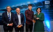 28 September 2019; Pictured is the Electric Ireland Minor Hurling All Star winner Cathal O'Neill of Limerick at the 2019 Electric Ireland Minor Star Awards alongside, from left, Munster Council chairman Liam Lenihan, Derek McGrath and Executive Director of ESB Marguerite Sayers. The Hurling Team of the Year was selected by an expert panel of GAA legends including Alan Kerins, Derek McGrath, Karl Lacey and Tomás Quinn. The Electric Ireland GAA Minor Star Awards create a major moment for Minor players, showcasing the outstanding achievements of individual performers throughout the Championship season. The awards also recognise the effort of those who support them day in and day out, from their coaches to parents, clubs and communities. #GAAThisIsMajor Photo by David Fitzgerald/Sportsfile