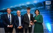 28 September 2019; Pictured is the Electric Ireland Minor Hurling All Star winner Billy Drennan of Kilkenny at the 2019 Electric Ireland Minor Star Awards alongside, from left, Munster Council chairman Liam Lenihan, Derek McGrath and Executive Director of ESB Marguerite Sayers. The Hurling Team of the Year was selected by an expert panel of GAA legends including Alan Kerins, Derek McGrath, Karl Lacey and Tomás Quinn. The Electric Ireland GAA Minor Star Awards create a major moment for Minor players, showcasing the outstanding achievements of individual performers throughout the Championship season. The awards also recognise the effort of those who support them day in and day out, from their coaches to parents, clubs and communities. #GAAThisIsMajor Photo by David Fitzgerald/Sportsfile