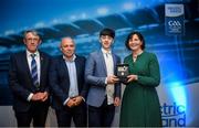 28 September 2019; Pictured is the Electric Ireland Minor Hurling All Star winner AJ Redmond of Wexford at the 2019 Electric Ireland Minor Star Awards alongside, from left, Munster Council chairman Liam Lenihan, Derek McGrath and Executive Director of ESB Marguerite Sayers. The Hurling Team of the Year was selected by an expert panel of GAA legends including Alan Kerins, Derek McGrath, Karl Lacey and Tomás Quinn. The Electric Ireland GAA Minor Star Awards create a major moment for Minor players, showcasing the outstanding achievements of individual performers throughout the Championship season. The awards also recognise the effort of those who support them day in and day out, from their coaches to parents, clubs and communities. #GAAThisIsMajor Photo by David Fitzgerald/Sportsfile