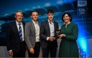 28 September 2019; Pictured is the Electric Ireland Minor Football All Star winner Ronan Boyle of Monaghan at the 2019 Electric Ireland Minor Star Awards alongside, from left, Munster Council chairman Liam Lenihan, Tomás Quinn and Executive Director of ESB Marguerite Sayers. The Football Team of the Year was selected by an expert panel of GAA legends including Alan Kerins, Derek McGrath, Karl Lacey and Tomás Quinn. The Electric Ireland GAA Minor Star Awards create a major moment for Minor players, showcasing the outstanding achievements of individual performers throughout the Championship season. The awards also recognise the effort of those who support them day in and day out, from their coaches to parents, clubs and communities. #GAAThisIsMajor Photo by David Fitzgerald/Sportsfile