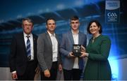 28 September 2019; Pictured is the Electric Ireland Minor Football All Star winner Oisín Tunney of Mayo at the 2019 Electric Ireland Minor Star Awards alongside, from left, Munster Council chairman Liam Lenihan, Tomás Quinn and Executive Director of ESB Marguerite Sayers. The Football Team of the Year was selected by an expert panel of GAA legends including Alan Kerins, Derek McGrath, Karl Lacey and Tomás Quinn. The Electric Ireland GAA Minor Star Awards create a major moment for Minor players, showcasing the outstanding achievements of individual performers throughout the Championship season. The awards also recognise the effort of those who support them day in and day out, from their coaches to parents, clubs and communities. #GAAThisIsMajor Photo by David Fitzgerald/Sportsfile
