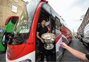 29 September 2019; Michael Darragh Macauley gets off the bus with the Sam Maguire Cup during the Dublin Senior Football teams homecoming at Merrion Square in Dublin. Expressway as official carriers of the Dublin senior football team are proud to have carried the Dubs to a historic 5 in a row. Expressway has been official carriers of Dublin GAA since 2015 and each year since Dublin have won the Sam Maguire trophy. Photo by David Fitzgerald/Sportsfile