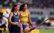 29 September 2019; Angelica Bengtsson of Sweden, right, after clearing 4.80m using a pole vaulting pole borrowed from Ninon Guillon-Romarin, of France, left, after hers broke whilst competing in the Women's Pole Vault Final during day three of the World Athletics Championships 2019 at the Khalifa International Stadium in Doha, Qatar. Photo by Sam Barnes/Sportsfile