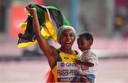 29 September 2019; Shelly-Ann Fraser-Pryce of Jamaica celebrates with her son Zyon after winning the Women's 100m Final during day three of the World Athletics Championships 2019 at the Khalifa International Stadium in Doha, Qatar. Photo by Sam Barnes/Sportsfile