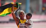29 September 2019; Shelly-Ann Fraser-Pryce of Jamaica celebrates with her son Zyon after winning the Women's 100m Final during day three of the World Athletics Championships 2019 at the Khalifa International Stadium in Doha, Qatar. Photo by Sam Barnes/Sportsfile