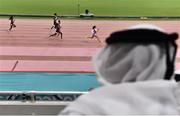 30 September 2019; A spectator wearing a thawb watches the Women's 400m heats during day four of the World Athletics Championships 2019 at the Khalifa International Stadium in Doha, Qatar. Photo by Sam Barnes/Sportsfile