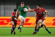 3 October 2019; Jack Carty of Ireland breats the tackles of Vasily Artemyev, left, and Tagir Gadzhiev of Russia during the 2019 Rugby World Cup Pool A match between Ireland and Russia at the Kobe Misaki Stadium in Kobe, Japan. Photo by Brendan Moran/Sportsfile