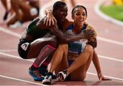 3 October 2019; Katarina Johnson-Thompson of Great Britain, right, celebrates with Odile Ahouanwanou of Benin after winning the Womens Heptathlon during day seven of the 17th IAAF World Athletics Championships Doha 2019 at the Khalifa International Stadium in Doha, Qatar. Photo by Sam Barnes/Sportsfile