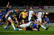 4 October 2019; Harry Byrne of Leinster dives over to score his side's seventh try, despite the tackle of Keelan Giles, left, and Scott Otten of Ospreys during the Guinness PRO14 Round 2 match between Leinster and Ospreys at the RDS Arena in Dublin. Photo by Seb Daly/Sportsfile