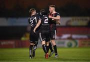 4 October 2019; Derek Pender, 2, celebrates with his Bohemians team-mates Luke Wade-Slater, left, and Scott Allardice, right, after scoring his side's goal during the SSE Airtricity League Premier Division match between Bohemians and Cork City at Dalymount Park in Dublin. Photo by Stephen McCarthy/Sportsfile