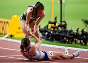 5 October 2019; Ciara Mageean of Ireland, top, helps Laura Muir of Great Britain after competing in the Women's 1500m Final during day nine of the 17th IAAF World Athletics Championships Doha 2019 at the Khalifa International Stadium in Doha, Qatar. Photo by Sam Barnes/Sportsfile