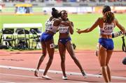 5 October 2019; Dina Asher-Smith of Great Britain, centre, celebrates team-mates, including  Daryll Neita, left, after winning a silver medal in the Women's 4x100m relay  during day nine of the 17th IAAF World Athletics Championships Doha 2019 at the Khalifa International Stadium in Doha, Qatar. Photo by Sam Barnes/Sportsfile