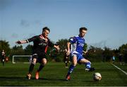 6 October 2019; Karl Melling of Leinster Senior League in action against Laurence Toland of Ulster Senior League during the FAI Michael Ward Inter League Tournament match between Leinster Senior League and Ulster Senior League at Hartstown Huntstown Football Club in Dublin. Photo by Harry Murphy/Sportsfile