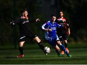 6 October 2019; Aaron Robinson of Leinster Senior League in action against Oisin Langan of Ulster Senior League during the FAI Michael Ward Inter League Tournament match between Leinster Senior League and Ulster Senior League at Hartstown Huntstown Football Club in Dublin. Photo by Harry Murphy/Sportsfile