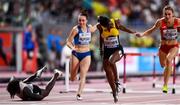 6 October 2019;  Janeek Brown of Jamaica, second from right, dips for the line, as Anne Zagre of Belgium, far left, falls whilst competing in Women's 100m Hurdles Semi-Finals during day ten of the 17th IAAF World Athletics Championships Doha 2019 at the Khalifa International Stadium in Doha, Qatar. Photo by Sam Barnes/Sportsfile
