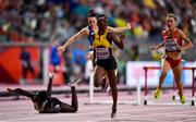 6 October 2019;  Janeek Brown of Jamaica, second from right, dips for the line, as Anne Zagre of Belgium, far left, falls whilst competing in Women's 100m Hurdles Semi-Finals during day ten of the 17th IAAF World Athletics Championships Doha 2019 at the Khalifa International Stadium in Doha, Qatar. Photo by Sam Barnes/Sportsfile