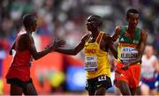 6 October 2019; Joshua Cheptegei of Uganda, centre, is congratulated by Yomif Kejelcha of Ethiopa, right, and Rhonex Kipruto of Kenya after winning the Men's 10,000m during day ten of the 17th IAAF World Athletics Championships Doha 2019 at the Khalifa International Stadium in Doha, Qatar. Photo by Sam Barnes/Sportsfile