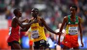 6 October 2019; Joshua Cheptegei of Uganda, centre, is congratulated by Yomif Kejelcha of Ethiopa, right, and Rhonex Kipruto of Kenya after winning the Men's 10,000m during day ten of the 17th IAAF World Athletics Championships Doha 2019 at the Khalifa International Stadium in Doha, Qatar. Photo by Sam Barnes/Sportsfile