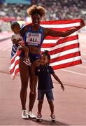 6 October 2019; Nia Ali of USA, celebrates with her son Titus Maximus Tinsley, right, and daughter, Yuri, after winning the Women's 100m Hurdles during day ten of the 17th IAAF World Athletics Championships Doha 2019 at the Khalifa International Stadium in Doha, Qatar. Photo by Sam Barnes/Sportsfile