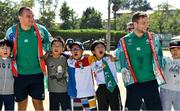 11 October 2019; Rhys Ruddock, left, and Jack Carty sing 'Ireland's Call' with students during a visit by the Ireland rugby squad to Kasuga Elementary School in Kusaga, Fukuoka, Japan. Photo by Brendan Moran/Sportsfile