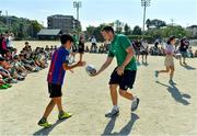 11 October 2019; Jack Carty with students during a visit by the Ireland rugby squad to Kasuga Elementary School in Kusaga, Fukuoka, Japan. Photo by Brendan Moran/Sportsfile