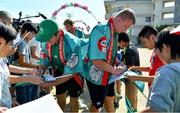 11 October 2019; Sean Cronin, left, and John Ryan sign autographs for students during a visit by the Ireland rugby squad to Kasuga Elementary School in Kusaga, Fukuoka, Japan. Photo by Brendan Moran/Sportsfile