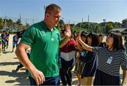 11 October 2019; John Ryan with students during a visit by the Ireland rugby squad to Kasuga Elementary School in Kusaga, Fukuoka, Japan. Photo by Brendan Moran/Sportsfile