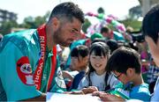 11 October 2019; Rob Kearney signs autographs for students during a visit by the Ireland rugby squad to Kasuga Elementary School in Kusaga, Fukuoka, Japan. Photo by Brendan Moran/Sportsfile