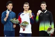 12 October 2019; Medal winners, from left, Lee Chih-kai of Taiwan, Silver, Max Witlock of England, Gold, and Rhys McClenaghan of Ireland with his Bronze medal after the pommel-horse final during the 49th FIG Artistic Gymnastics World Championships at Stuttgart in Germany. Photo by Ricardo Bufolin/Sportsfile