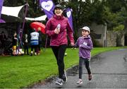 13 October 2019; The Deerpark Junior parkrun where Vhi hosted a special event to celebrate their partnership with parkrun Ireland. Vhi hosted a lively warm up routine which was great fun for children and adults alike. Crossing the finish line was a special experience as children were showered with bubbles and streamers to celebrate their achievement and each child received a gift. Junior parkrun in partnership with Vhi support local communities in organising free, weekly, timed 2km runs every Sunday at 9.30am. To register for a parkrun near you visit www.parkrun.ie.  Photo by Ramsey Cardy/Sportsfile