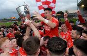 13 October 2019; Michael Gallagher and Trillick players celebrate with the O'Neill Cup after the Tyrone County Senior Club Football Championship Final match between Errigal Ciaran and Trillick at Healy Park in Omagh, Tyrone. Photo by Oliver McVeigh/Sportsfile